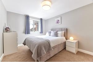 a bedroom with a bed and a window at Host & Stay - Castle View in Seahouses +2 photos