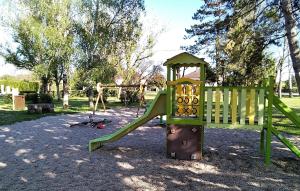 a playground with a slide in a park at Gite de Parcey in Parcey