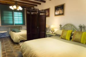 Ένα ή περισσότερα κρεβάτια σε δωμάτιο στο Gallart - Turistico rural