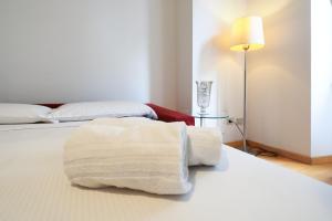 Posteľ alebo postele v izbe v ubytovaní PrimoPiano - Copernico 49