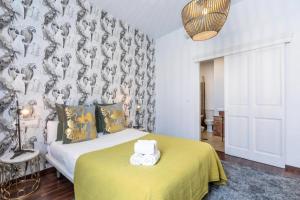 Posteľ alebo postele v izbe v ubytovaní Catedral Suites Jerez