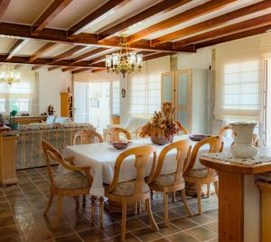 a kitchen and dining room with a table and chairs at Gallart - Turistico rural in La Pobla de Cérvoles