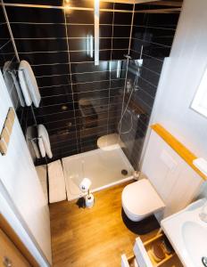 a small bathroom with a shower and a toilet at Nordic Natura in Garður