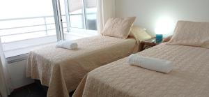 Postel nebo postele na pokoji v ubytování Penthouse Céntrico con Vista al Mar, Parrilla Privada y Terraza Espaciosa + 23 fotografií