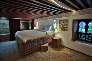 Postel nebo postele na pokoji v ubytování RIAD LOUDAYA AND SPA