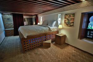 Postel nebo postele na pokoji v ubytování RIAD LOUDAYA AND SPA