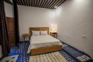 Postel nebo postele na pokoji v ubytování RIAD LOUDAYA AND SPA