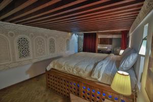 Postel nebo postele na pokoji v ubytování RIAD LOUDAYA AND SPA