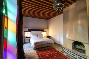 Postel nebo postele na pokoji v ubytování RIAD LOUDAYA AND SPA
