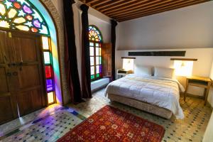 Postel nebo postele na pokoji v ubytování RIAD LOUDAYA AND SPA