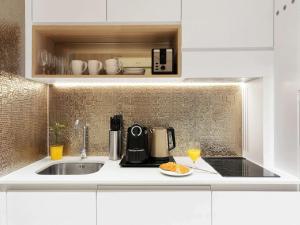 A cozinha ou kitchenette de Adagio Premium The Palm