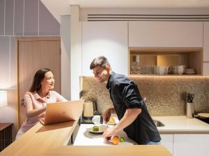 Os clientes hospedados em Adagio Premium The Palm