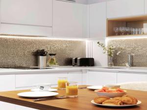 A cozinha ou kitchenette de Adagio Premium The Palm