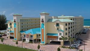 an aerial view of a resort with a parking lot at Sunset Vistas Two Bedroom Beachfront Suites in St. Pete Beach