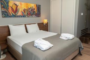 Uma cama ou camas num quarto em Doğa Thermal Health & Spa