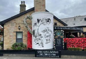 a building with a large sculpture in front of it at The High Flyer in Ely