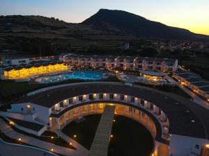 an aerial view of a resort at night at GH Santina Resort & SPA in Valledoria