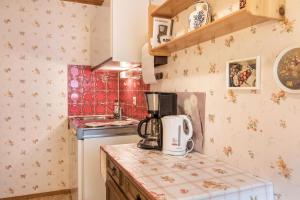 a kitchen with a coffee maker on a counter at Am Wehrastrand App 2 in Todtmoos