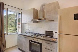 Kuchyňa alebo kuchynka v ubytovaní G House Dolceacqua