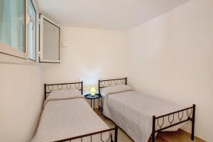 Posteľ alebo postele v izbe v ubytovaní G House Dolceacqua