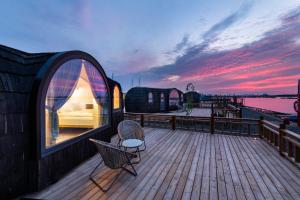 a room on a deck with a view of the water at Iglupark in Tallinn