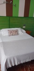 Cama o camas de una habitación en Hotel Arcos-Coruña