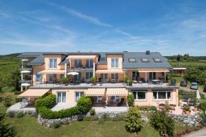 an aerial view of a large house with a yard at Sonnenhof Hagnau in Hagnau