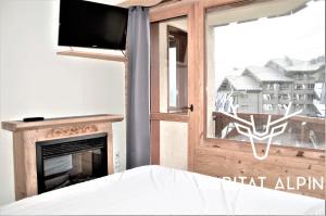 TV a/nebo společenská místnost v ubytování Apartment ski in/out Val Thorens