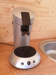 a blender sitting on a counter next to a sink at B&B La ferme du Château de Broich in Plombières