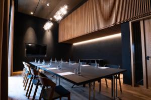 a large conference room with a long table and chairs at Villa Boutique Hotel in Straubing +27 photos