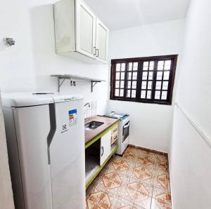 Η κουζίνα ή μικρή κουζίνα στο Ohana Casa Boraceia +10 φωτογραφίες