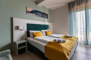 Postel nebo postele na pokoji v ubytování Hotel Limone