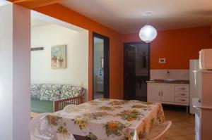 Cama o camas de una habitación en Casa Ilhabela - melhor custo benefício