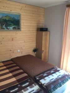 En eller flere senge i et værelse på Agropensjonat Tramp z góralskim spa