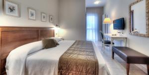 Voodi või voodid majutusasutuse Hotel Belvedere Thiene toas