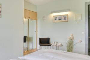 Voodi või voodid majutusasutuse Hôtel Le Funi de Cossonay toas