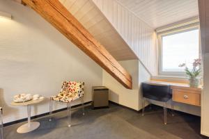 Istumisnurk majutusasutuses Hôtel Le Funi de Cossonay