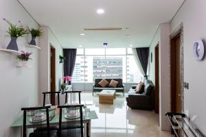 a living room with a couch and a table at Vortex suites klcc by Sofia in Kuala Lumpur