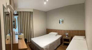 Postel nebo postele na pokoji v ubytování Real Hotel