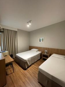 Llit o llits en una habitació de Real Hotel