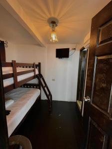 Poschodová posteľ alebo postele v izbe v ubytovaní Cabaña Cielo y Luna