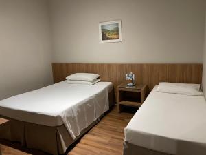 Postel nebo postele na pokoji v ubytování Real Hotel