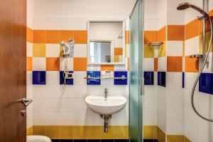 a bathroom with a sink and a shower at Hotel Nuova Italia in Florence