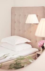 
En eller flere senge i et værelse på Hotel Diplomat Stockholm
