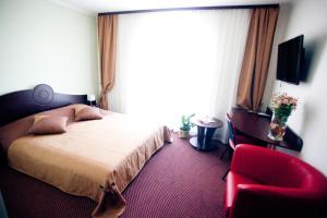 Postel nebo postele na pokoji v ubytování Terminal-A Hotel