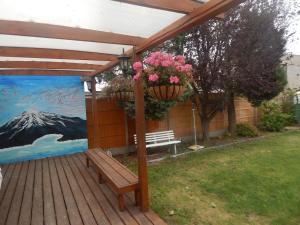 a wooden deck with a bench and a painting at Science Park Suite in Cambridge