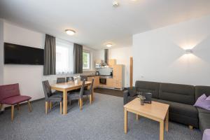 Telewizja i/lub zestaw kina domowego w obiekcie Appartements Insieme