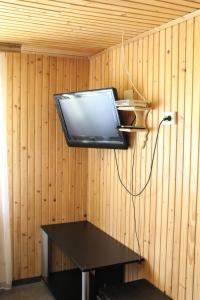 a laptop computer hanging from a wall in a room at Гостьовий дім "У Ані" in Yablunytsya
