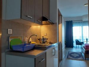 a kitchen with a sink and a counter top at villa vagelis in Mourteri