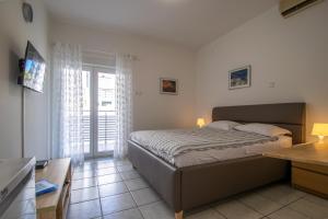 Posteľ alebo postele v izbe v ubytovaní Apartments Lantina
